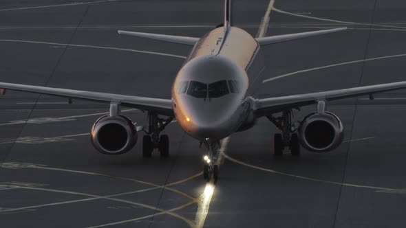 Aircraft Taxiing at the Airport in the Dusk alt