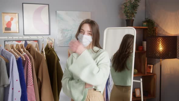 Adult Girl Wearing Cute Sweatshirt in Clothes Concept Store or Showroom Stylist Shopping Assistance alt