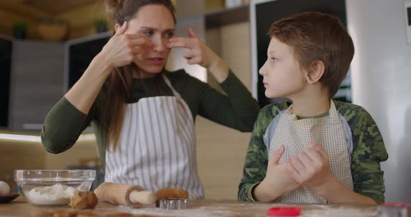 Mom and Baby Boy Cut Out Homemade Cookies with Shapes Form alt