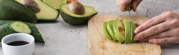 Premium Photo  Woman cutting avocado on cutting board to prepare breakfast