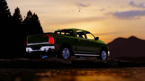 Brown Pickup Standing on Rocky Field at Sunset