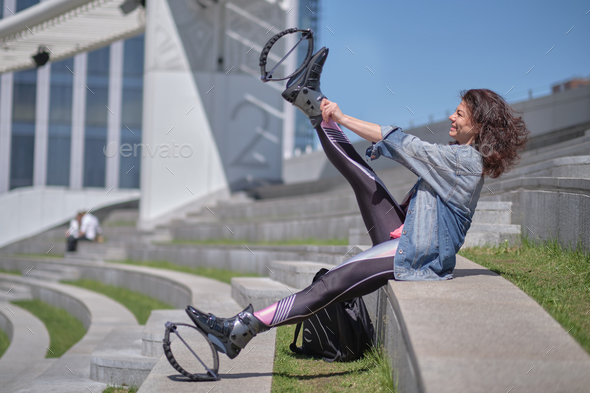 Fit legs in kangoo jumping shoes. womanpreparing for Kangoo Jumping  training Stock Photo by yavdat