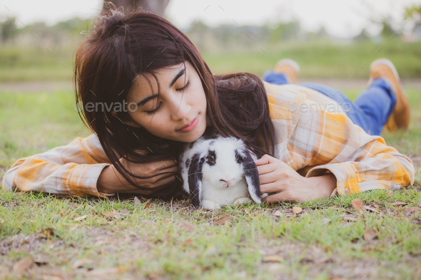 beautiful pretty portrait of young Asian woman person with cute rabbit