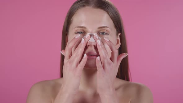 Beautiful Woman Applying Nose Patch alt