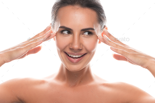 Front View Of Attractive Naked Woman Touching Face And Looking Away Isolated On White Stock