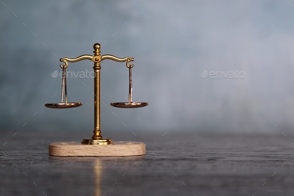 Balancing scale on top of wooden table