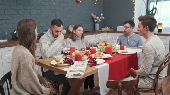 Friends Drink Wine. One of the Friends Started Coughing. The Concept of Isolation and Health Care. alt