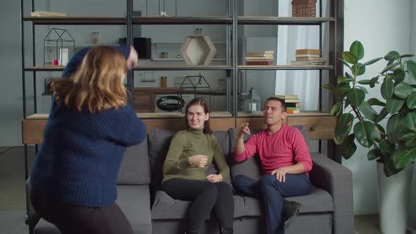 Deaf-mute People Playing Guessing Game at Home alt