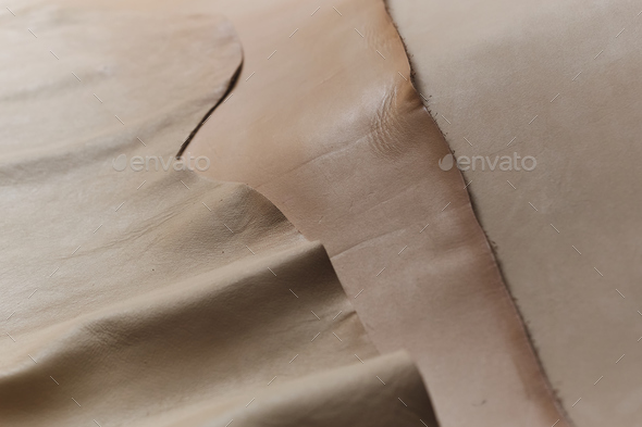 display of eco-friendly, beige leather swatches that combine style and sustainability. trend of