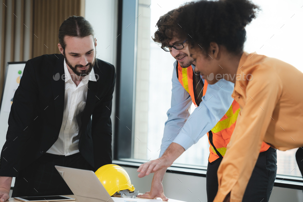 Group of young multi-ethnic male and female engineers and architects ...