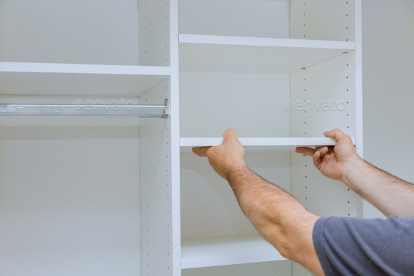 Handyman service in the process of assembly and installation for furniture closet cabinet
