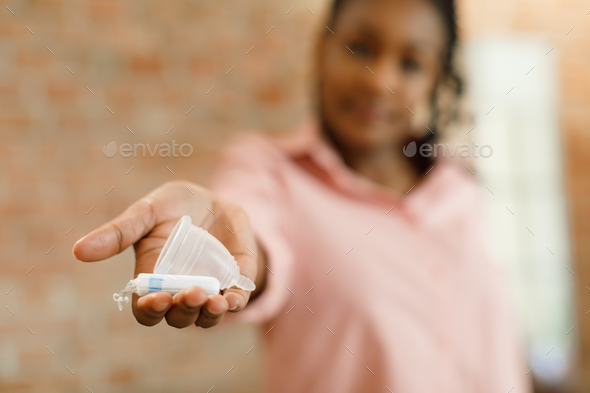 Black woman with cupped hands to receive Stock Photo