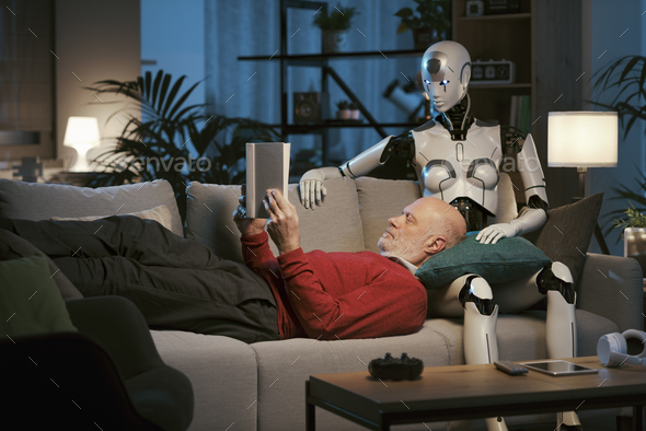 Senior man and android robot reading a book together