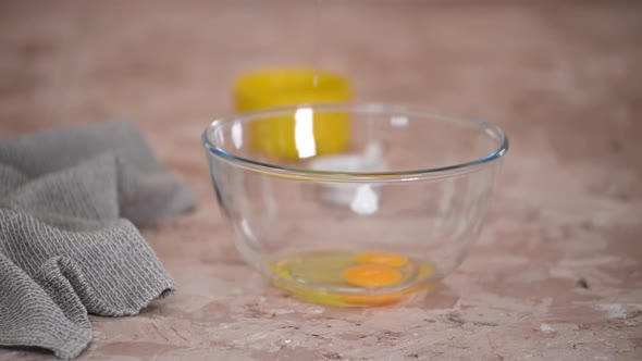 Woman Beating Eggs with Mixer on Table Closeup