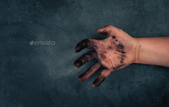 Dirty hands covered with color, fuel oil, mechanic worker, repair job