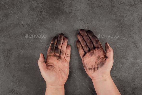 Dirty hands covered with color, fuel oil, mechanic worker, repair job