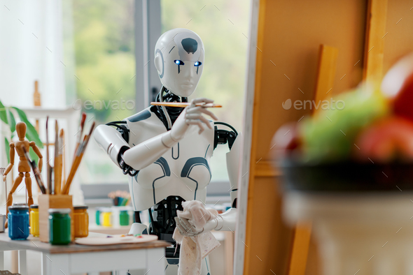Android AI robot painting in the studio
