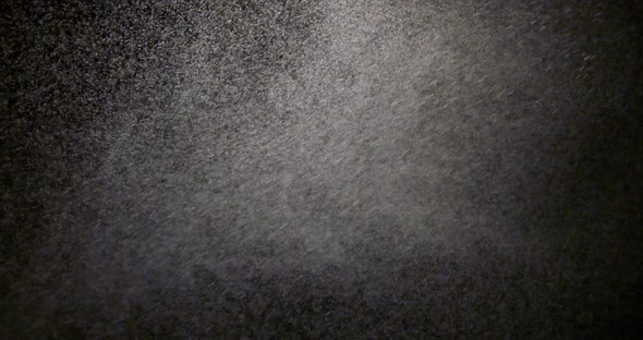 The effect of spraying water on a black background is suitable to replace in your video