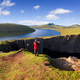 Tourist photographs view of Lake Leitisvatn or Sorvagsvatn, Faroe Islands - PhotoDune Item for Sale