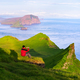A man photographs a view from Mykines, Faroe Islands - PhotoDune Item for Sale