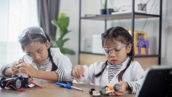 Asia students learn at home in coding robot cars and electronic