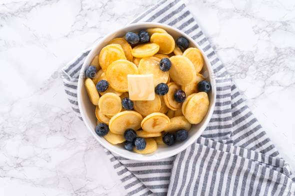 Mini pancake cereal Stock Photo by arina-habich