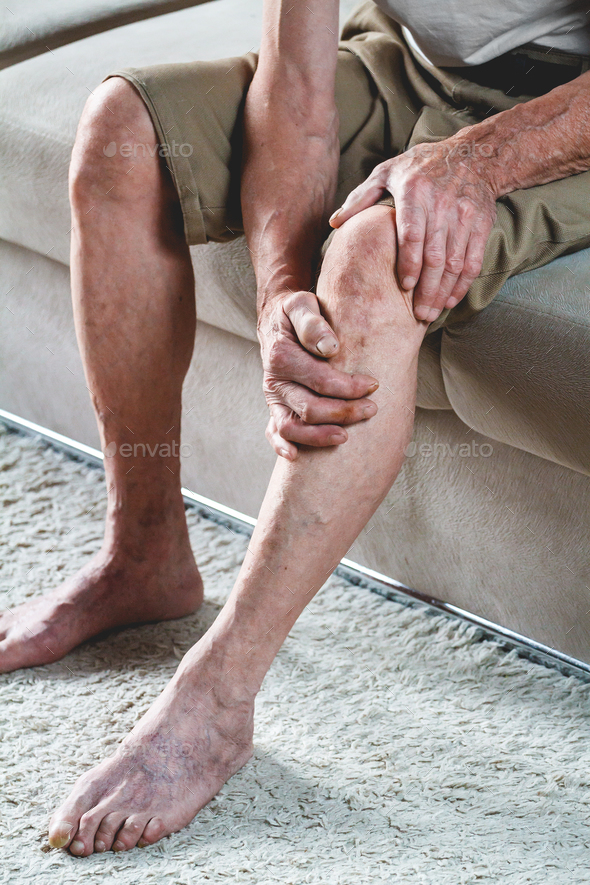 Pain in the legs and knees of an elderly senior
