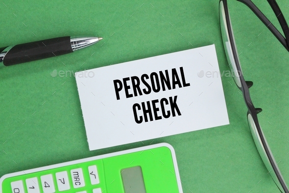 calculator, pen and glasses with the word personal check.