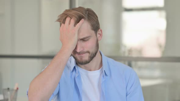 Portrait of Disappointed Young Creative Man Reacting Loss alt