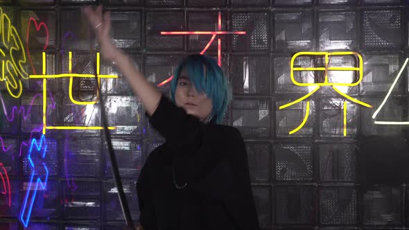 A Young Man or Woman is Holding a Japanese Katana Sword alt