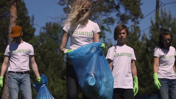 Young People Family Recycle Plastic Bottle Collecting Plastic Waste for Recycling in Green Park on alt