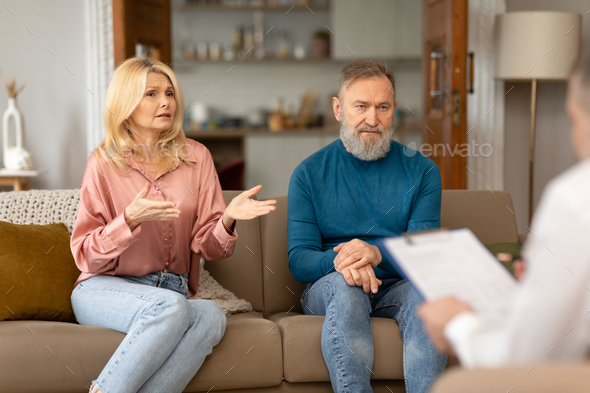 Unhappy Senior Spouses Seeking Support From Professional Psychologist Sitting Indoor