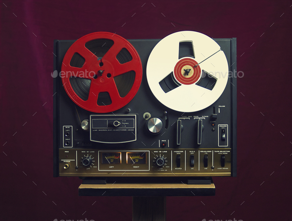 Close up shot of a vintage reel tape recorder on a purple background Stock  Photo by wirestock