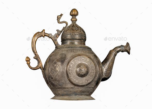 Copper desert tea pot, antique metal teapot isolated on white background,  antique kettle, golden teapot, metal teapot, Chinese teapot on white  background, antique teapot, golden teapot, metal kettle. Stock Photo