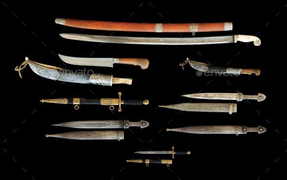 Set of antique knives and daggers isolated on a black background, Central Asian, Uzbekistan