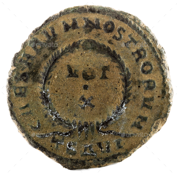 Closeup shot of an ancient Roman coin with emperor Crispus inscription