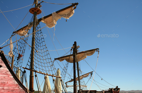 Low angle shot of ragged sails on a pirate ship during daylight