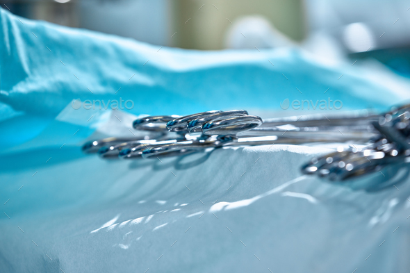Close-up of surgical instruments on the table in the operating room, modern medicine, sterilization