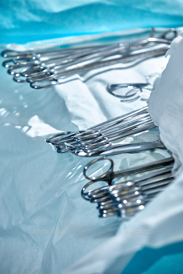 Close-up of surgical instruments on the table in the operating room, modern medicine, sterilization
