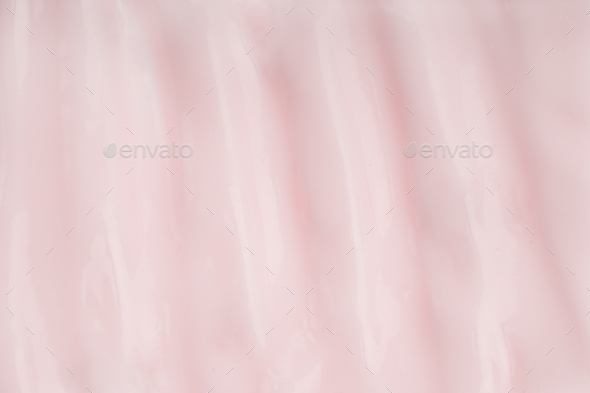 Face cream thick texture. Pink cleanser foam. Yogurt background, dairy product. Moisturizer sample