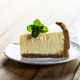 Slice of New York cheesecake with a sprig of mint - PhotoDune Item for Sale