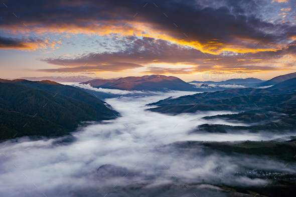 Amazing flowing morning fog in summer mountains - Stock Photo - Images
