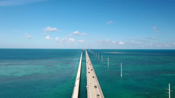 Vehicles Driving On Seven Mile Bridge Across Florida Keys In Monroe County, Florida. aerial alt