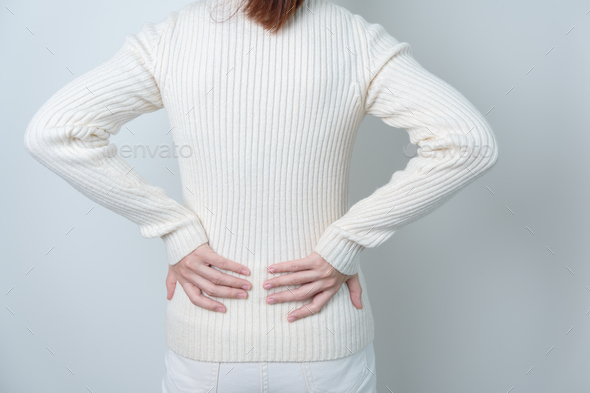 woman having back pain. Urinary system and Stones