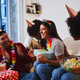 A young Latina celebrating her birthday at home together with her multi-ethnic friends - PhotoDune Item for Sale