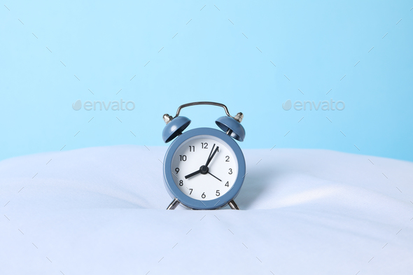 Concept of sleep and wake up with alarm clock