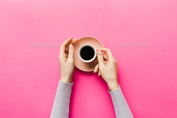 Minimalistic style woman hand holding a cup of coffee Stock Photo by  snegok1967