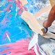 Drip painting expression art on canvas with blue, pink and beige colors, artist art performance - PhotoDune Item for Sale