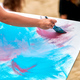 Amateur painter drawing picture on white canvas at outdoor art exercise, painting performance - PhotoDune Item for Sale