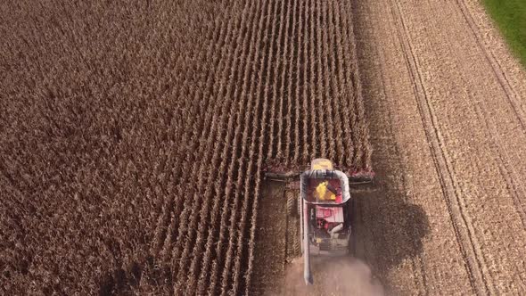 Combine Harvesting Corn In Southeast Michigan Near Carlton Michigan On A Sunny Day Of Summer - aeria alt